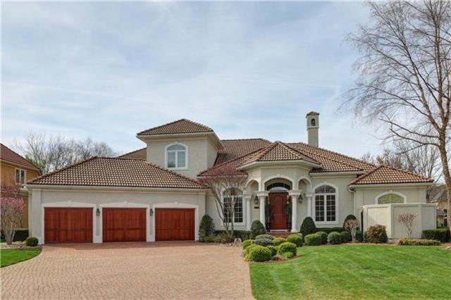 Stunning from front to back..paver drive, custom s