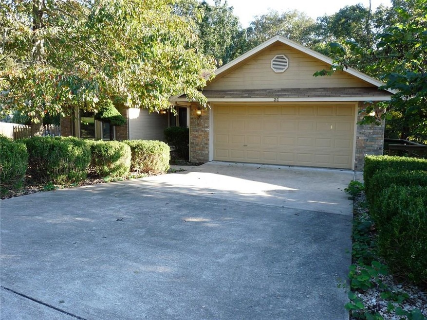 This home features a 2-car attached garage and lots of beautiful landscaping in the front yard.