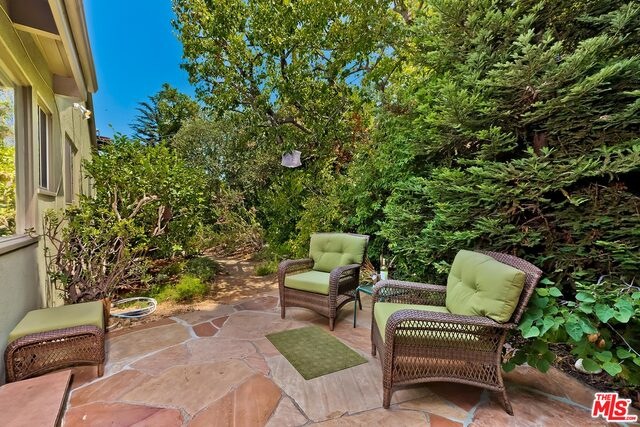 stone patio in backyard off family rm