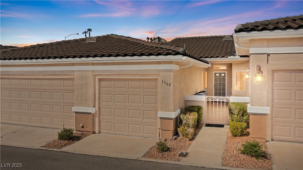 View of front of home with a tile roof, stucco sid