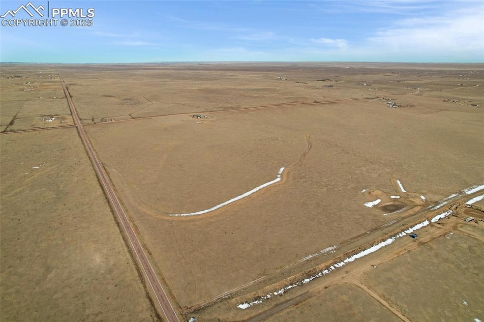 Birds eye view of property with a rural view