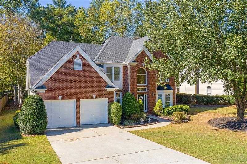 Inviting front brick home, with a wide and long Fl