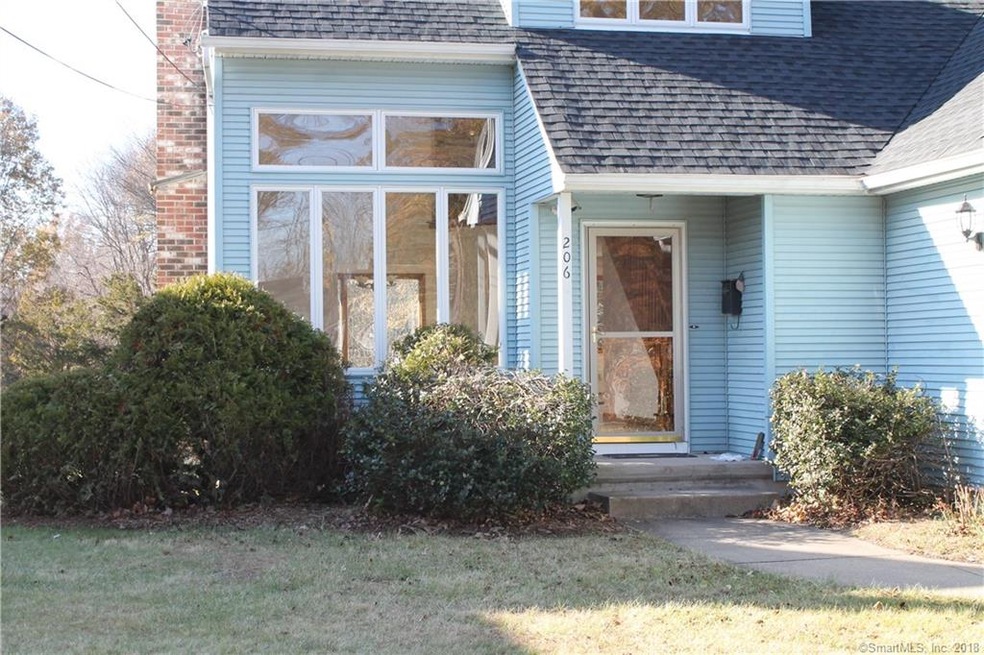 Covered Front entrance adored with holly