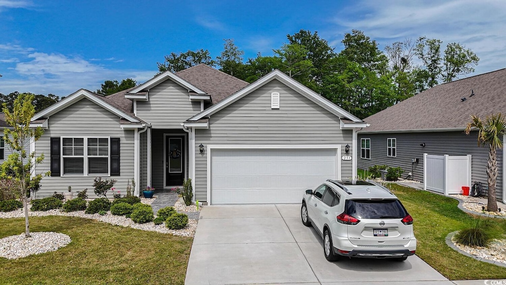 Traditional-style home featuring driveway, a front