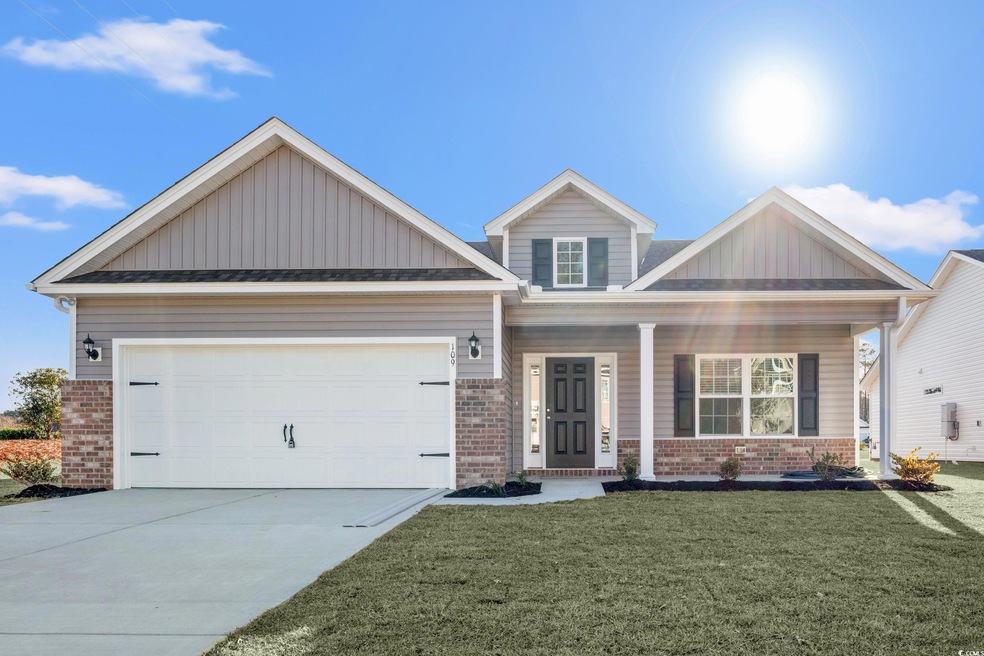 Craftsman-style house with a garage and a front la