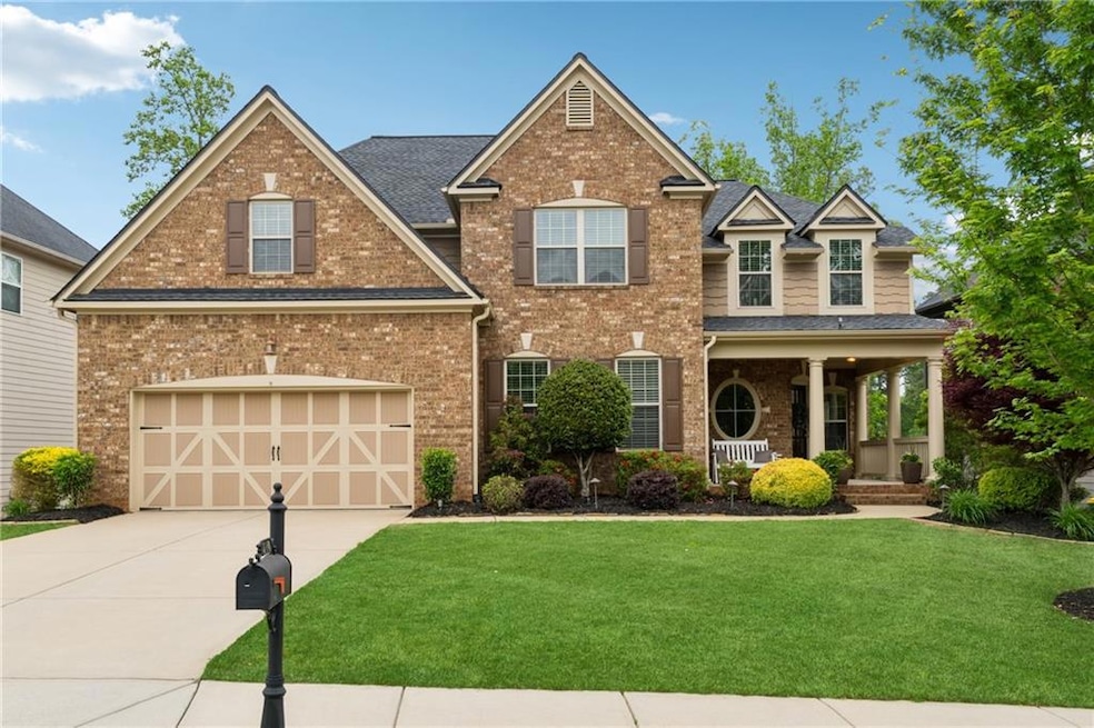 View of front of home featuring concrete driveway,