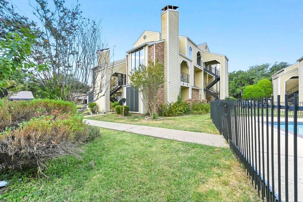 View of side of property with a lawn, a chimney, f