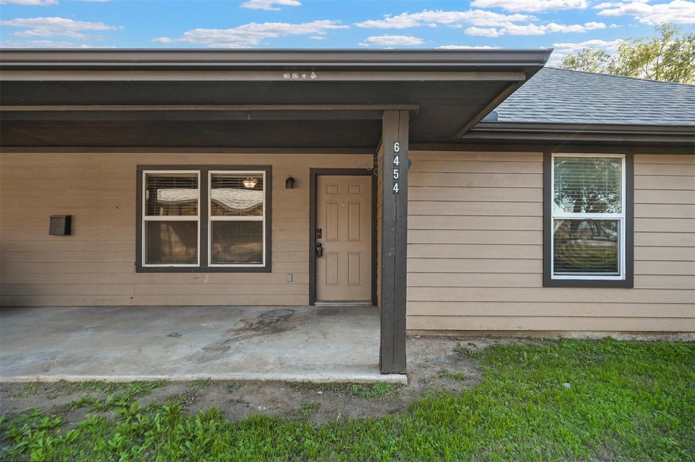 Doorway to property with covered porch