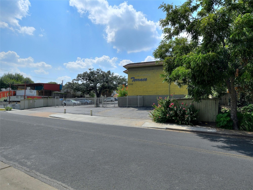 View of asphalt road featuring a gate