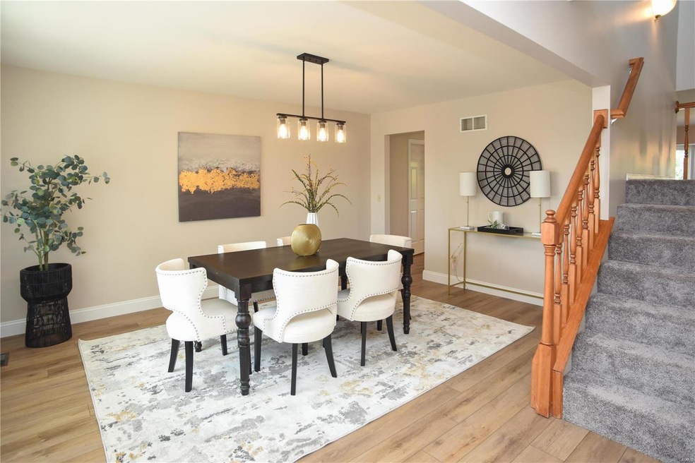 The dining room is to the left of the spacious ent