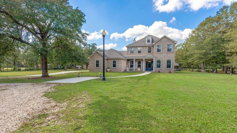 Beautiful Home nestled on almost 4 acres with TONS