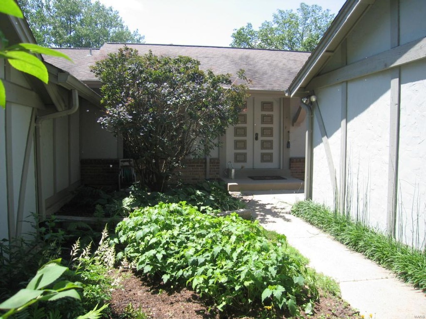 Private gated entry with gardens and patio.