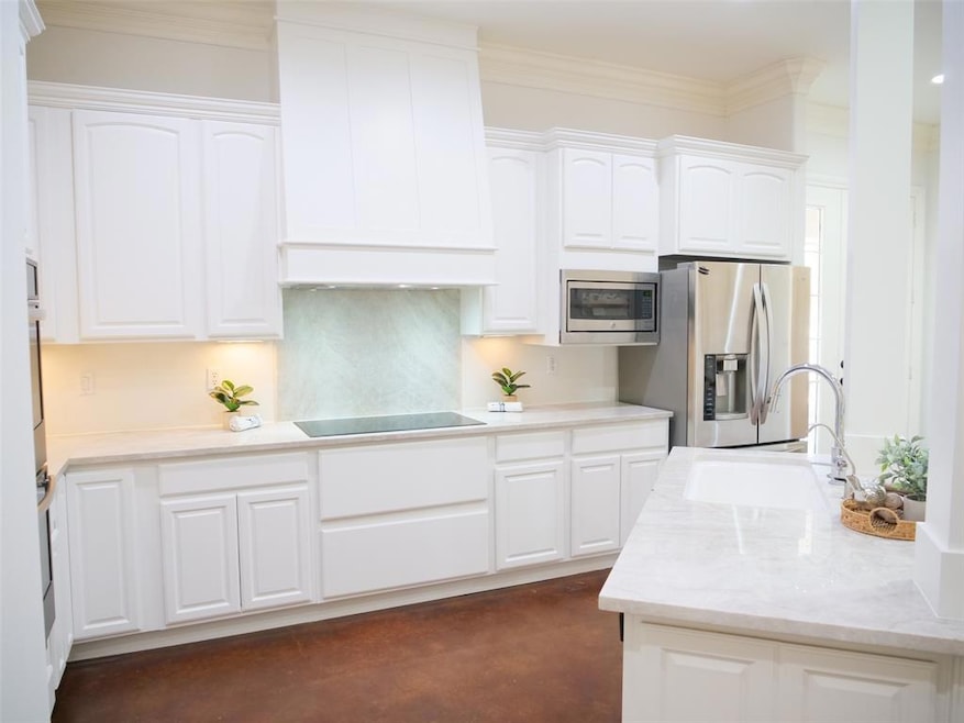 White Cabinets and custom vent hood