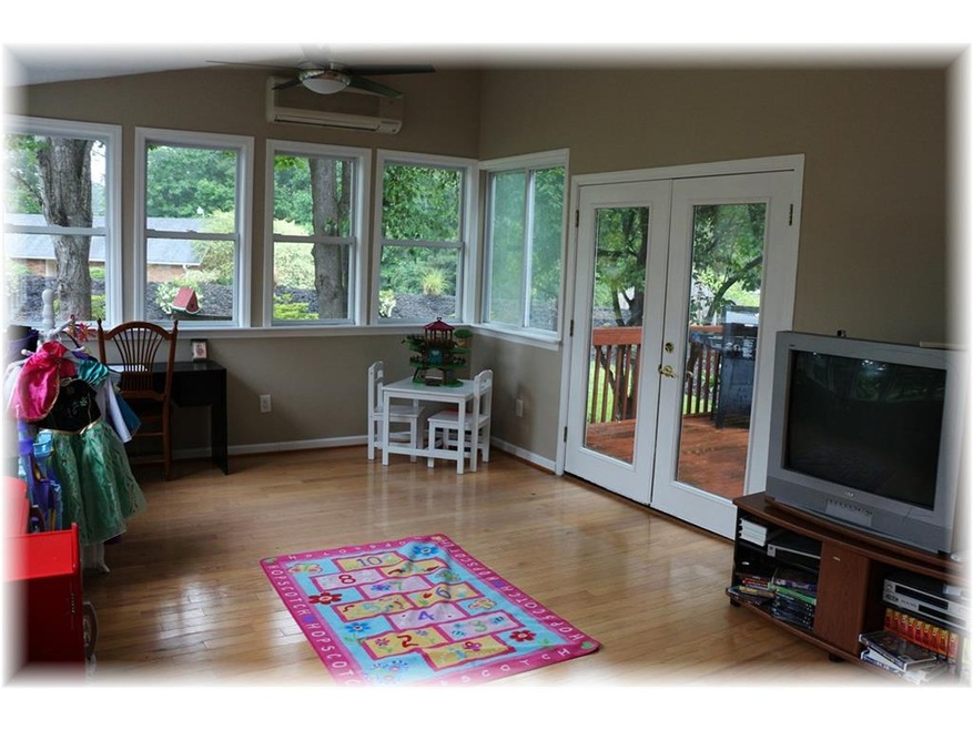 This HUGE, sunny sunroom is an enormous asset to t