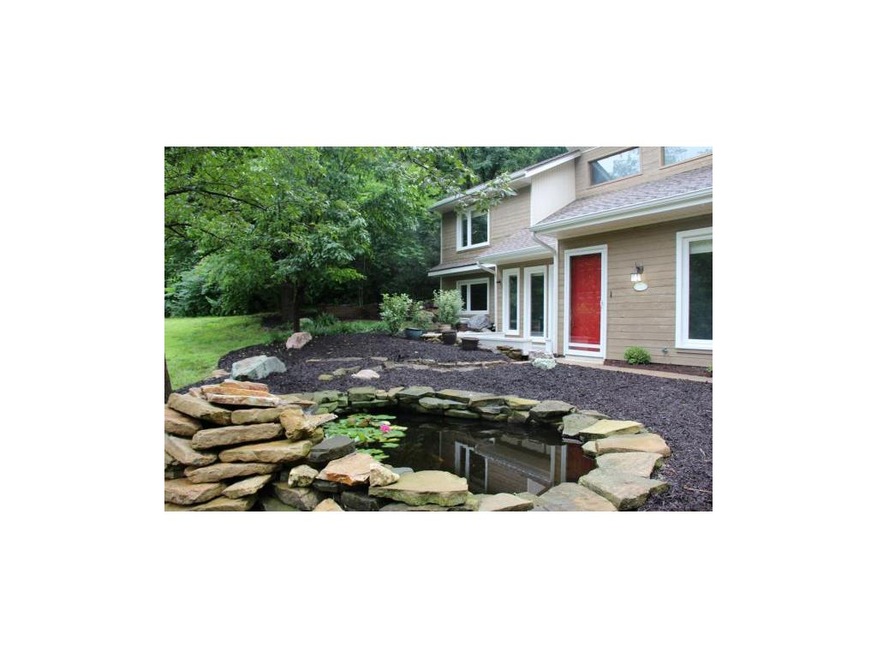 Koi pond with waterfall, what a great front yard.