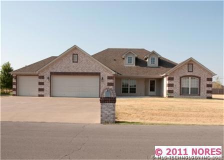 Beautiful Full Brick Family Home offers a three ca