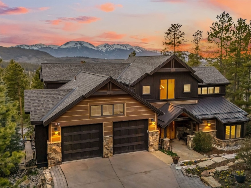 View of front featuring a shingled roof, concrete