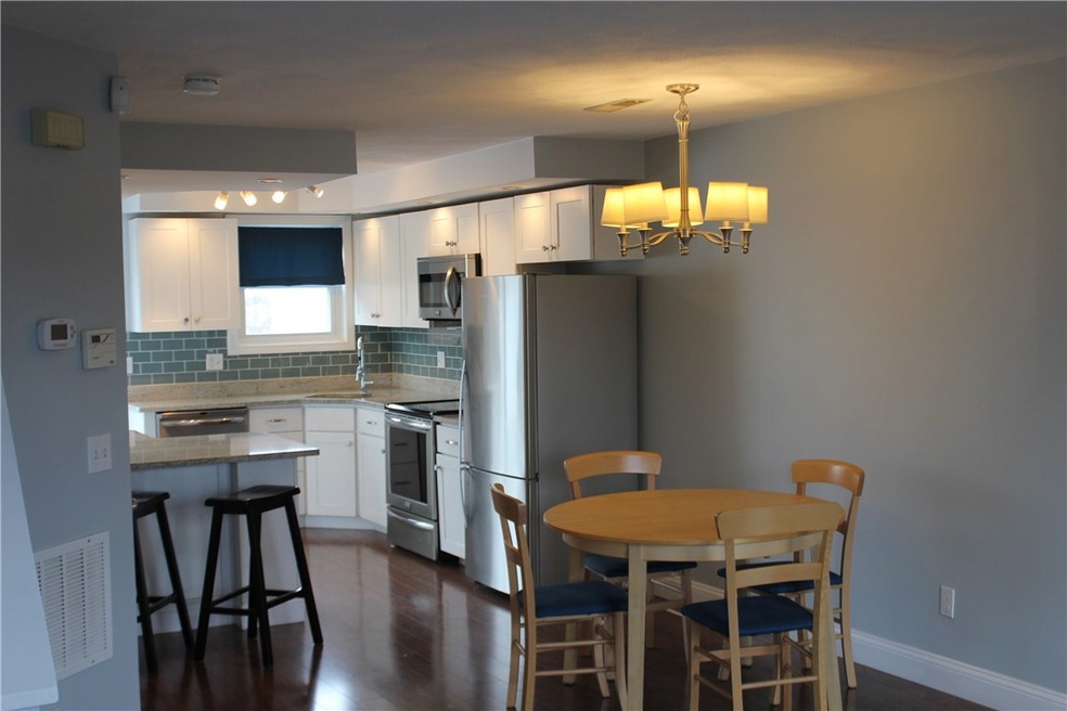 Open kitchen dining, granite counter tops, two-top