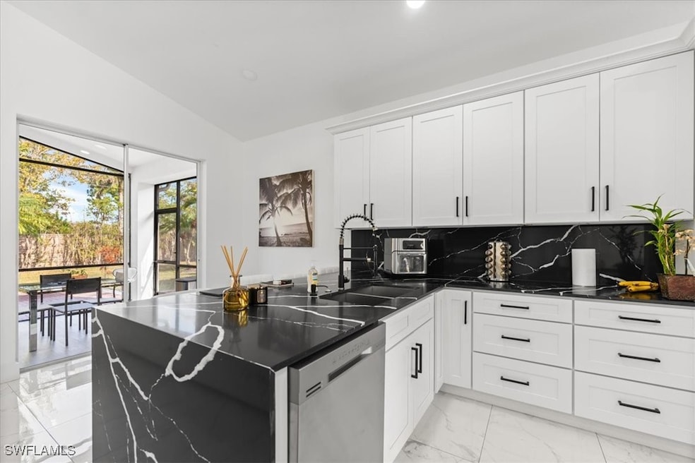 Kitchen featuring tasteful backsplash, stainless s
