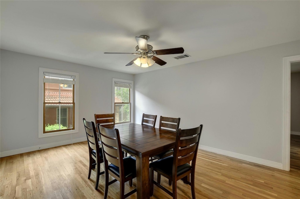 Dining area featuring baseboards, light wood-styl