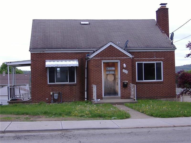 All brick cape has vinyl replacement windows, a wa
