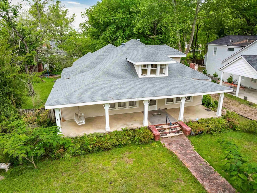View of front of property featuring a shingled roo