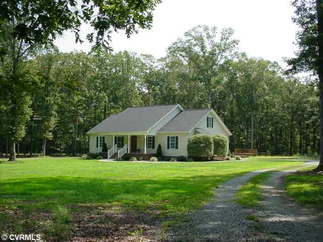 Exterior Front - HOME HAS 4 BEDROOMS, 2.5 BATHS, AND SITS ON 6.92 ACRES OF WOODED ACREAGE.  1/4 MILE DRIVEWAY LEADS YOU INTO AN OPEN AREA THAT OFFERS A HUGE POLE BARN BUILT 2 CAR GARAGE WITH A WORKSHOP , OFFICE, &  700 SQ. FT. ROOM W/ROUGH/IN FULL BA