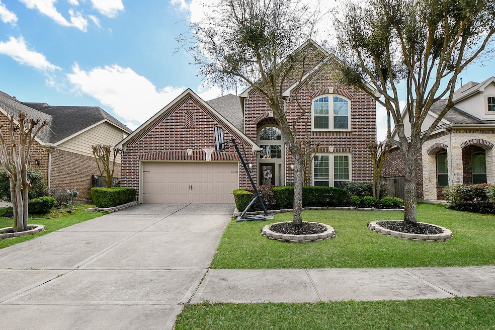 Charming two-story brick home with a manicured law