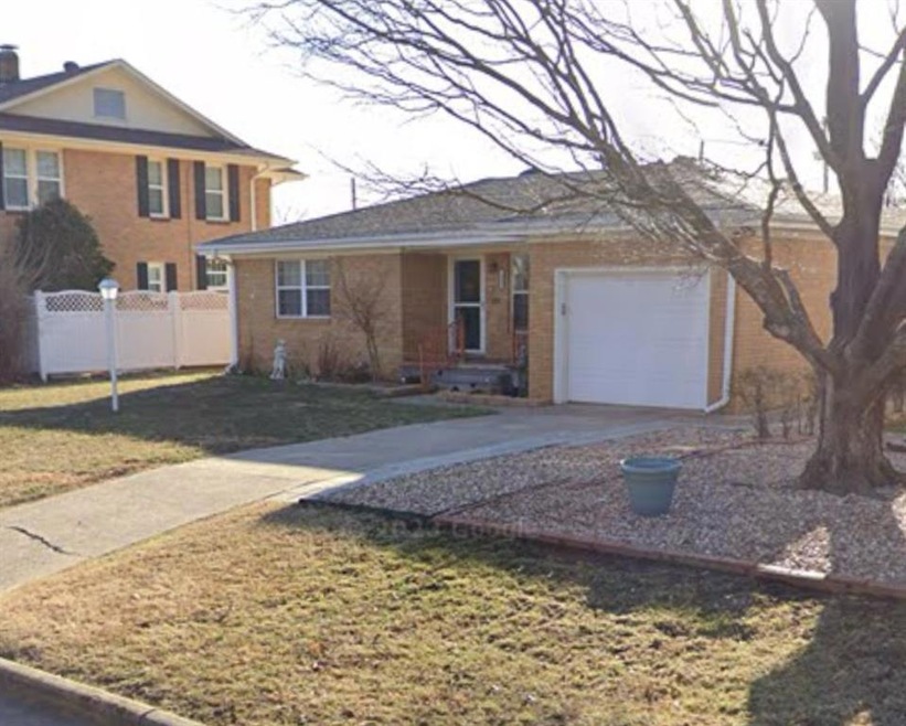 View of front of property featuring a garage