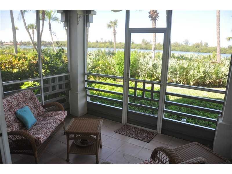 View. Covered, screened lanai with river & sunset