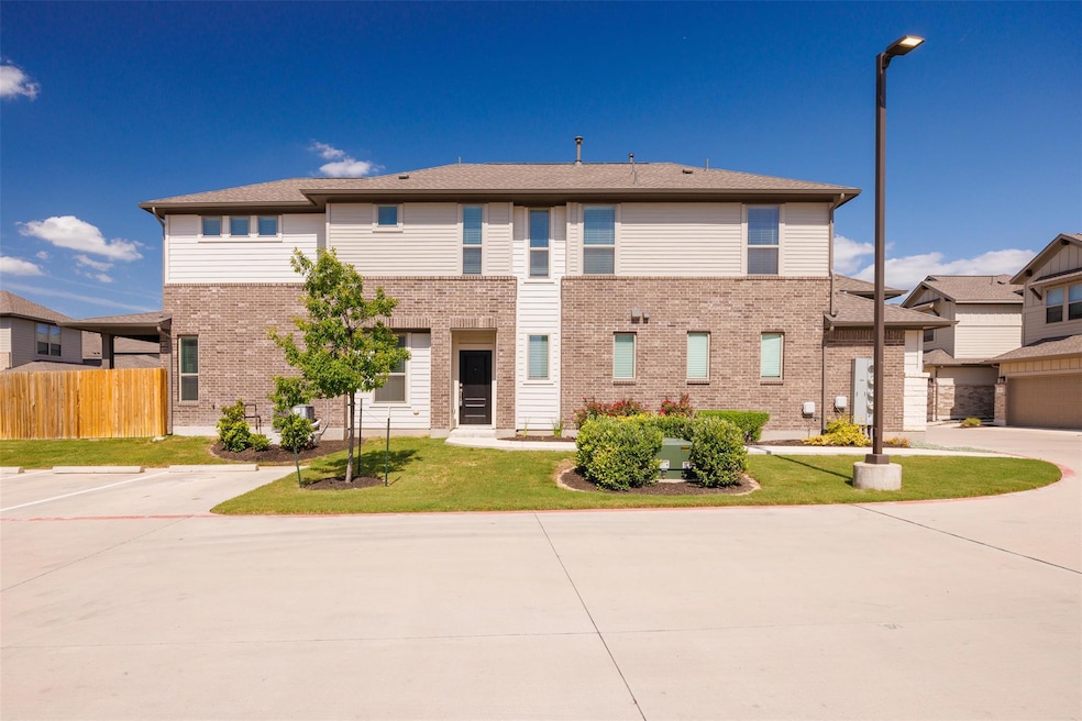 View of front of home featuring brick siding