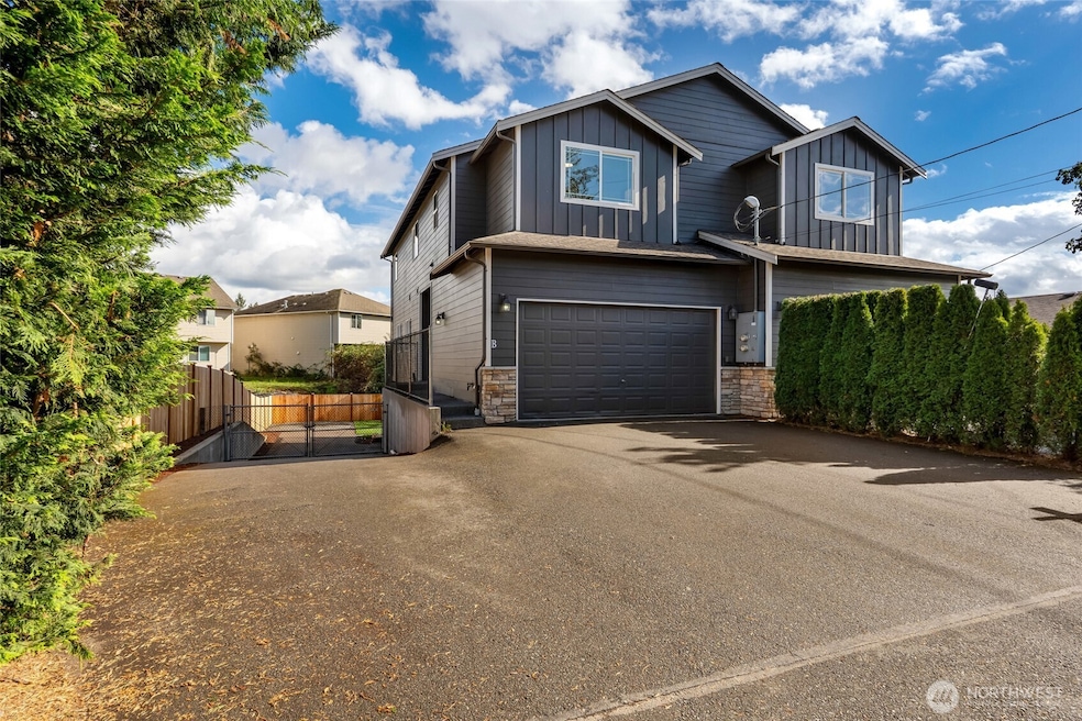 Ample Parking space and ANOTHER Garage below beyond the gate. Lots pf possibilities.