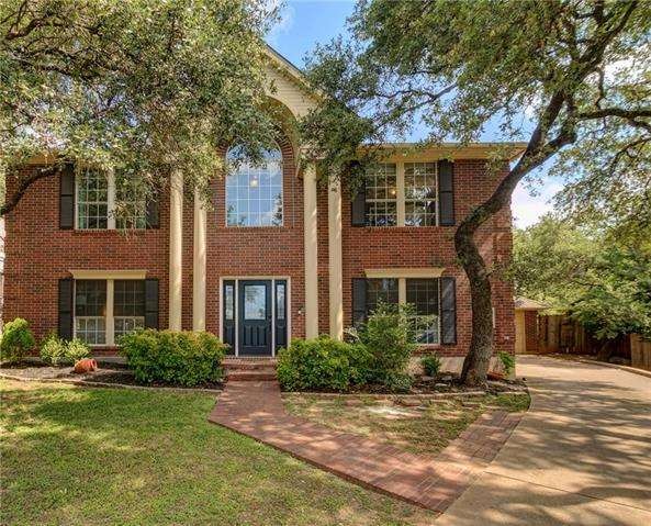Home is nestled in a canopy of trees at the end of