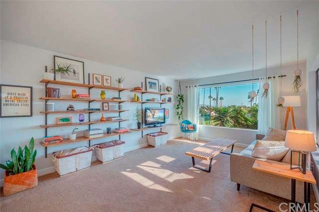 Upper level living room with large picture style w