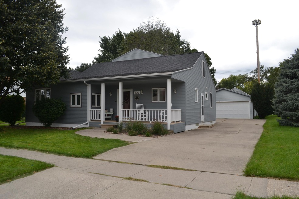 Front of house with large garage behind