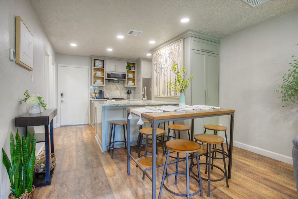 The front door opens into the beautiful kitchen an