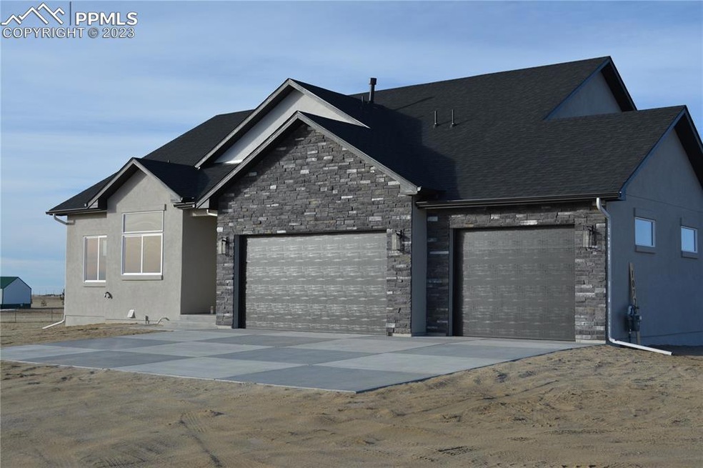 Stucco and stone exterior. Pikes Peak Views