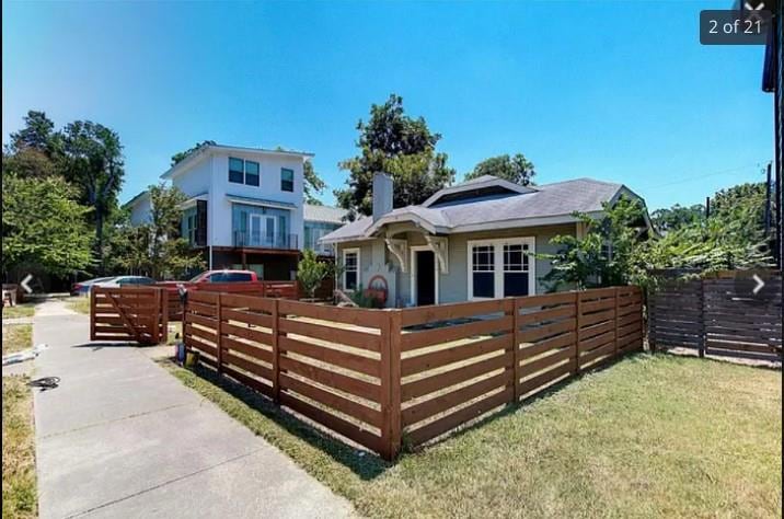 View of front of property featuring a fenced fron