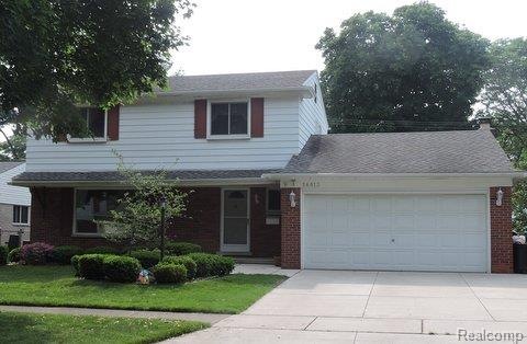 FRONT ELEVATION W/ WIDE NEWER CONCRETE DRIVEWAY