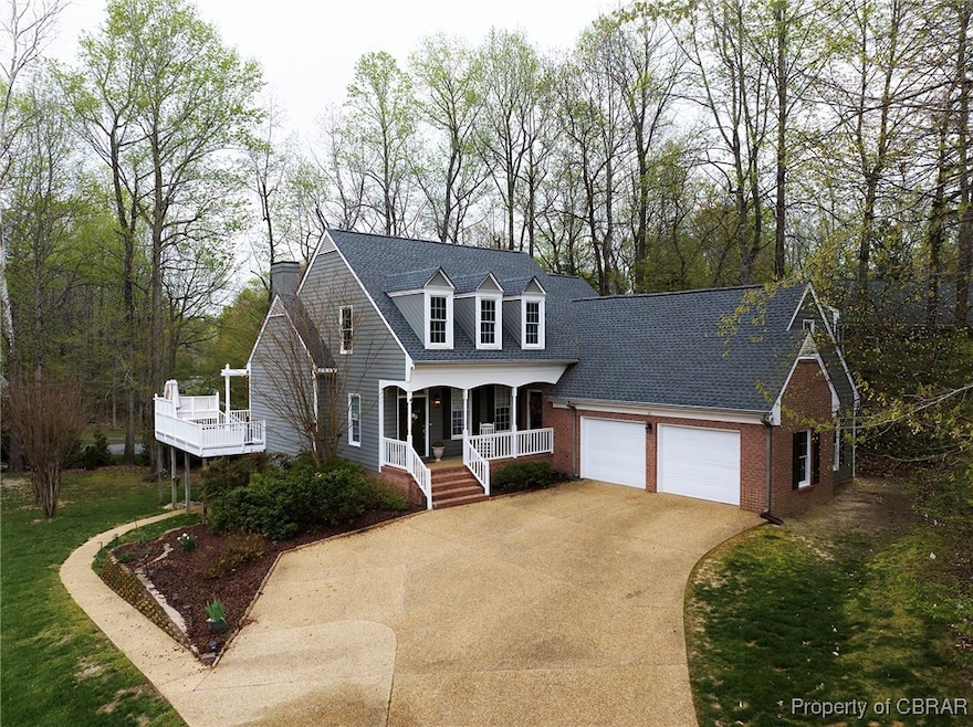 Cape cod house featuring concrete driveway, roof w
