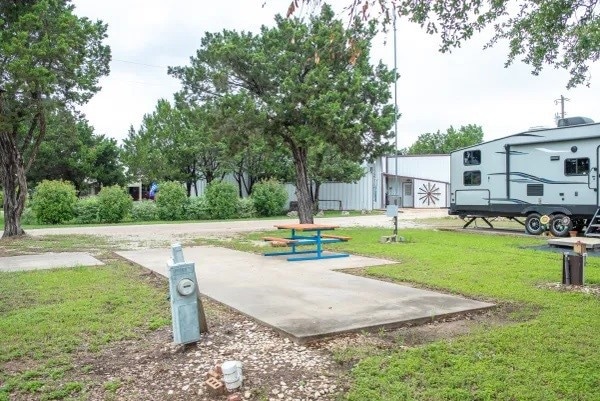 View of property's community with a lawn