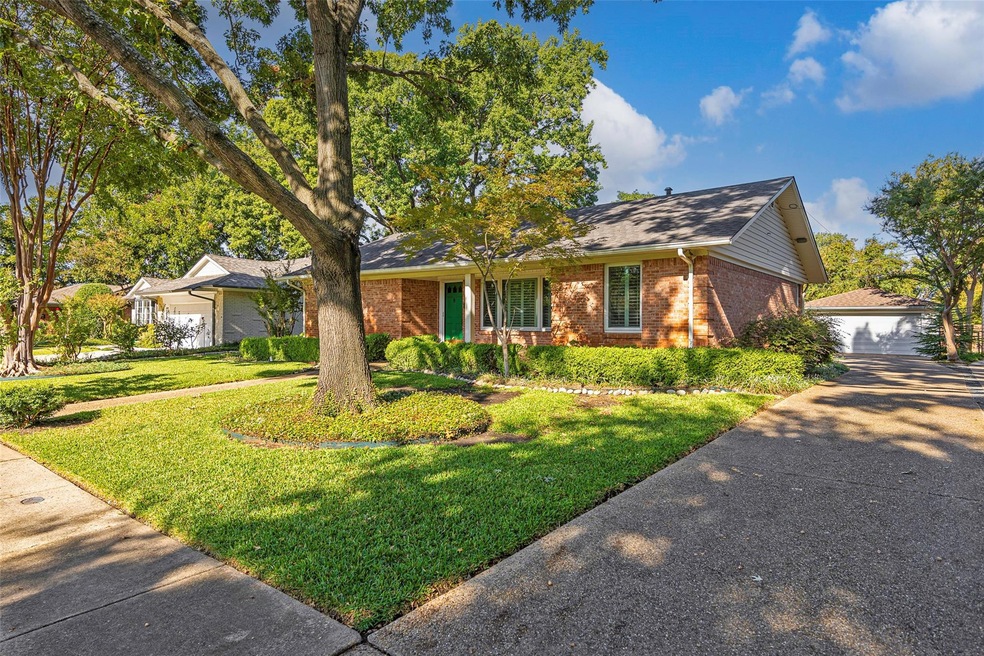 Single story home featuring a garage and a front l