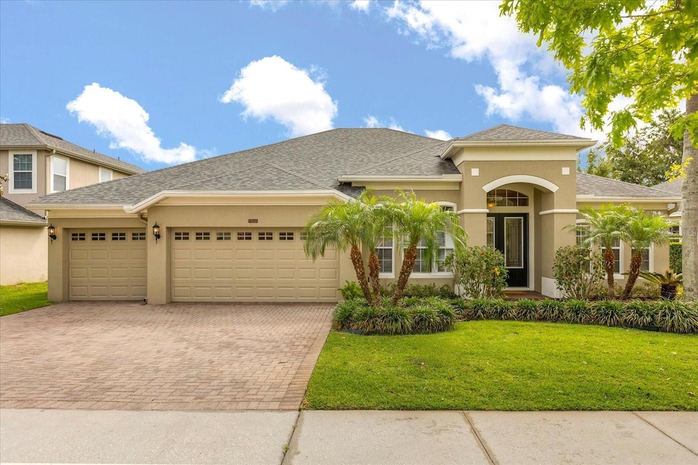 Welcome Home! 3 car garage with a large pavered driveway