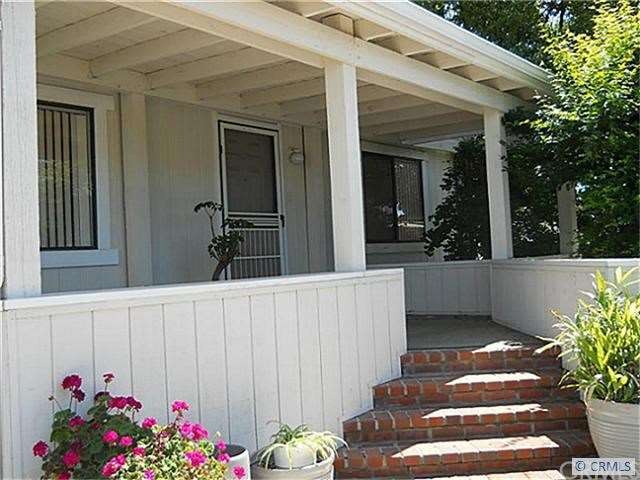 Lovely shaded front porch perfect for relaxing or
