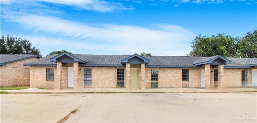 View of front of property with brick siding