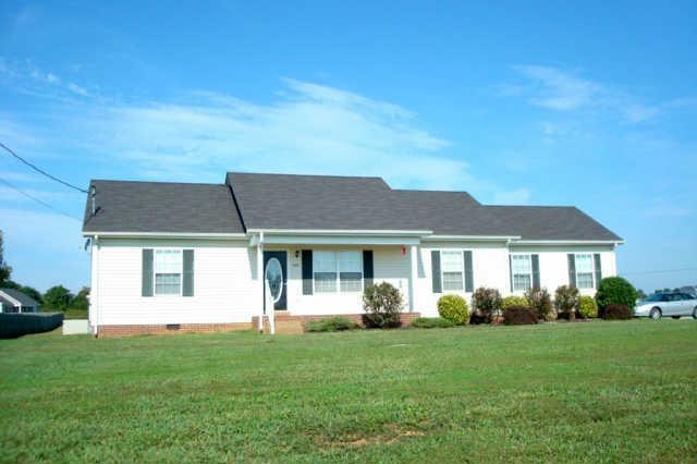 Front View showing established yard and impressive home