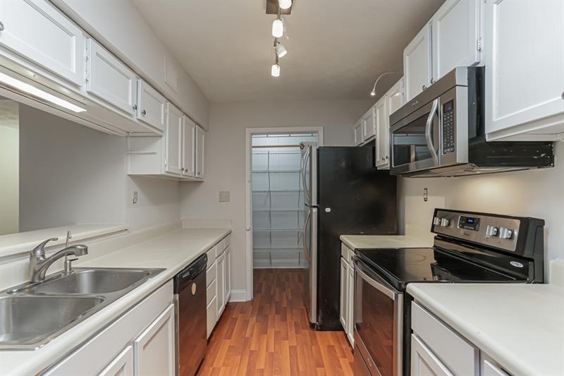 Kitchen features large pantry and stainless steel 