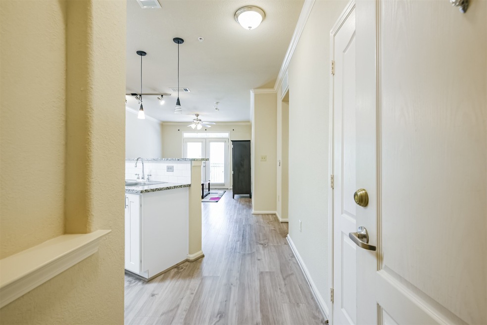 Bright, welcoming entrance with light wood floorin