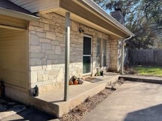Front of house with a porch and parking space. Mir