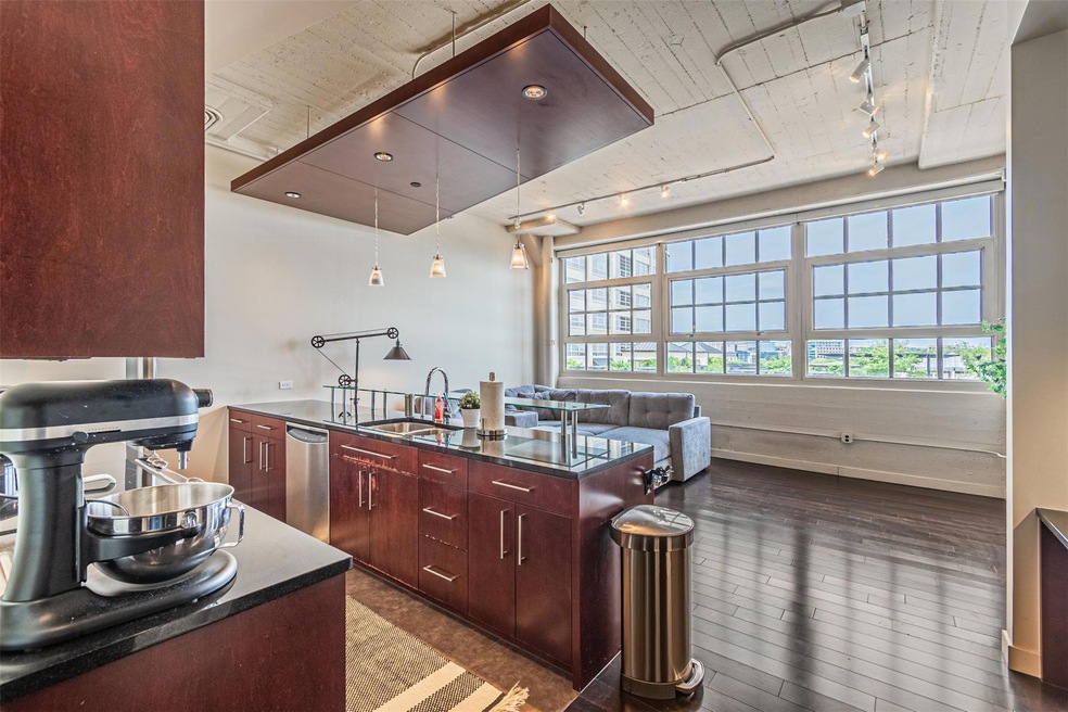 Kitchen with plenty of natural light, sink, dishwa